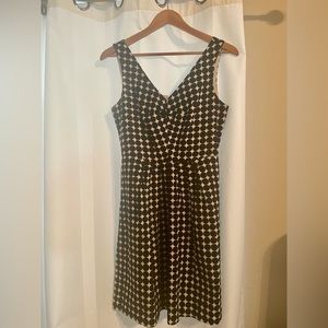 Multi purpose black and white dress with flattering neckline and flare skirt.